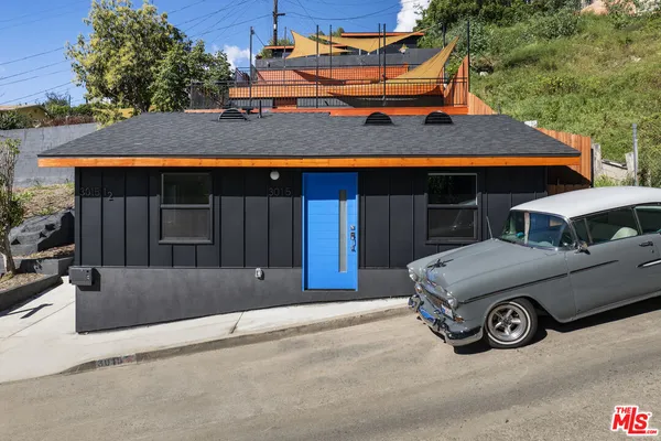 front view of house with a car park in front of it