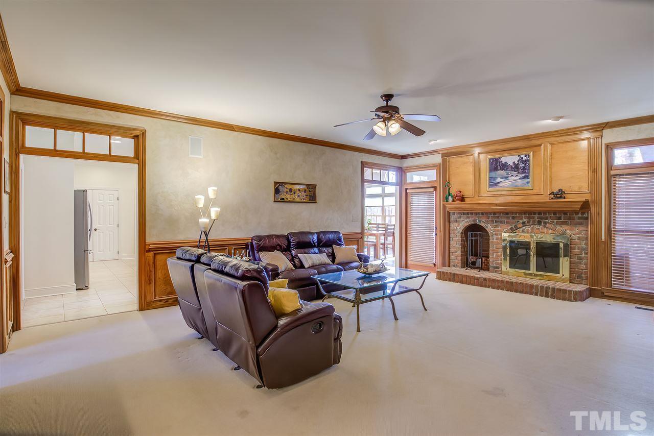 12129 Lockhart Lane Raleigh, NC 27614 - Photo 11 of 30 Large yet cozy family room with fireplace and wet bar.