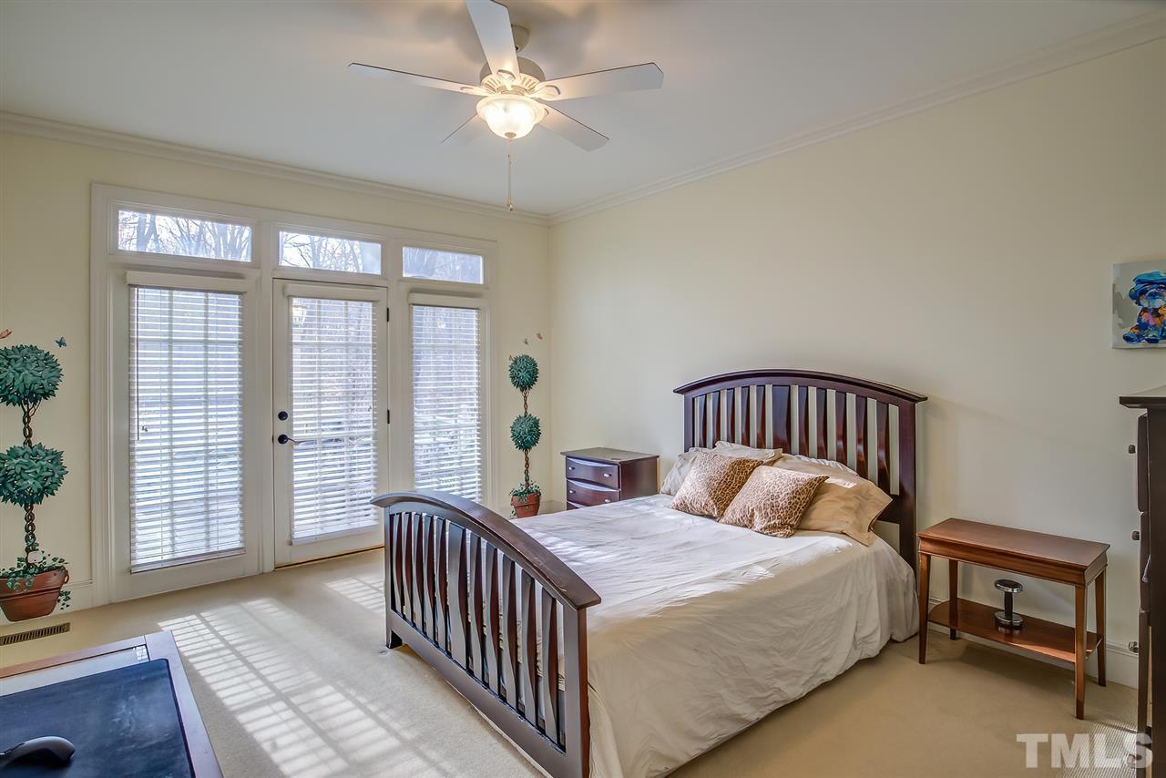 12129 Lockhart Lane Raleigh, NC 27614 - Photo 21 of 30 Main floor bedroom with full bath and access to one of the two decks.