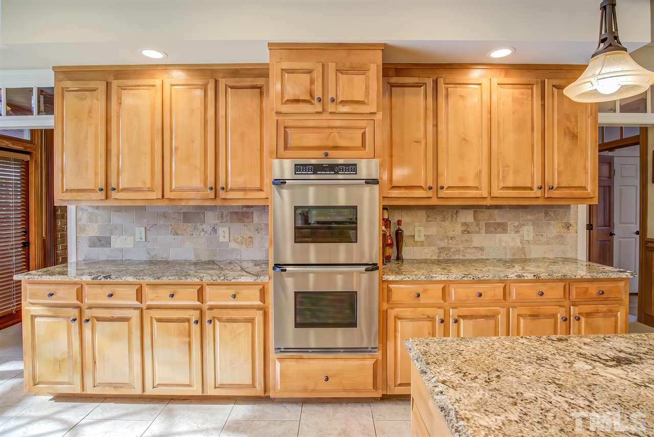 Gourmet kitchen with wall ovens.