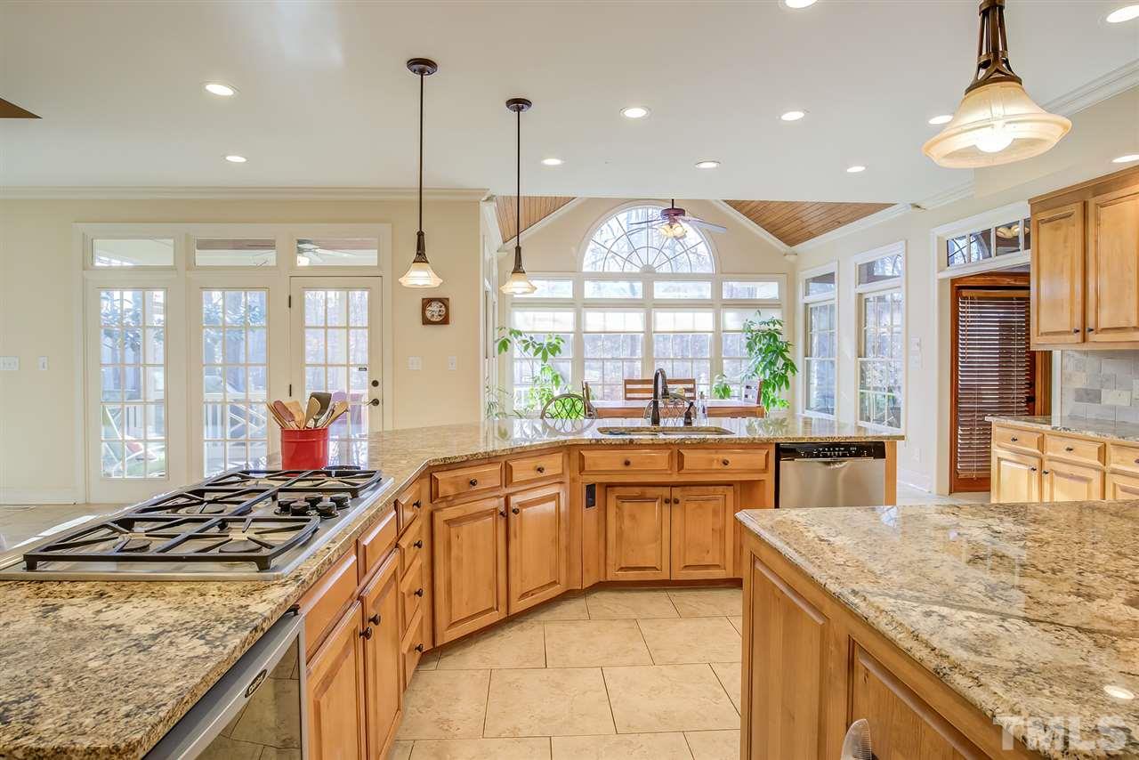 12129 Lockhart Lane Raleigh, NC 27614 - Photo 8 of 30 Gas cooktop and wine fridge