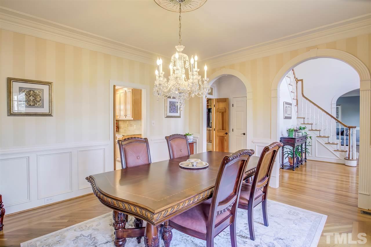 12129 Lockhart Lane Raleigh, NC 27614 - Photo 10 of 30 Formal Dining room with hardwoods, archways, and moldings.