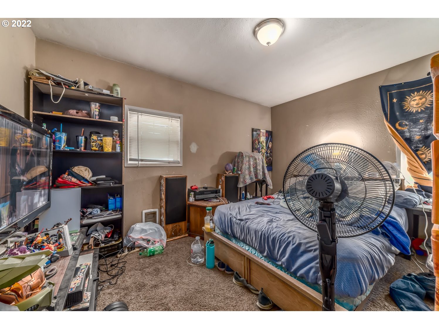 1409 Parker Street Springfield, OR 97477 - Photo 11 of 19 a bedroom with furniture and a chandelier
