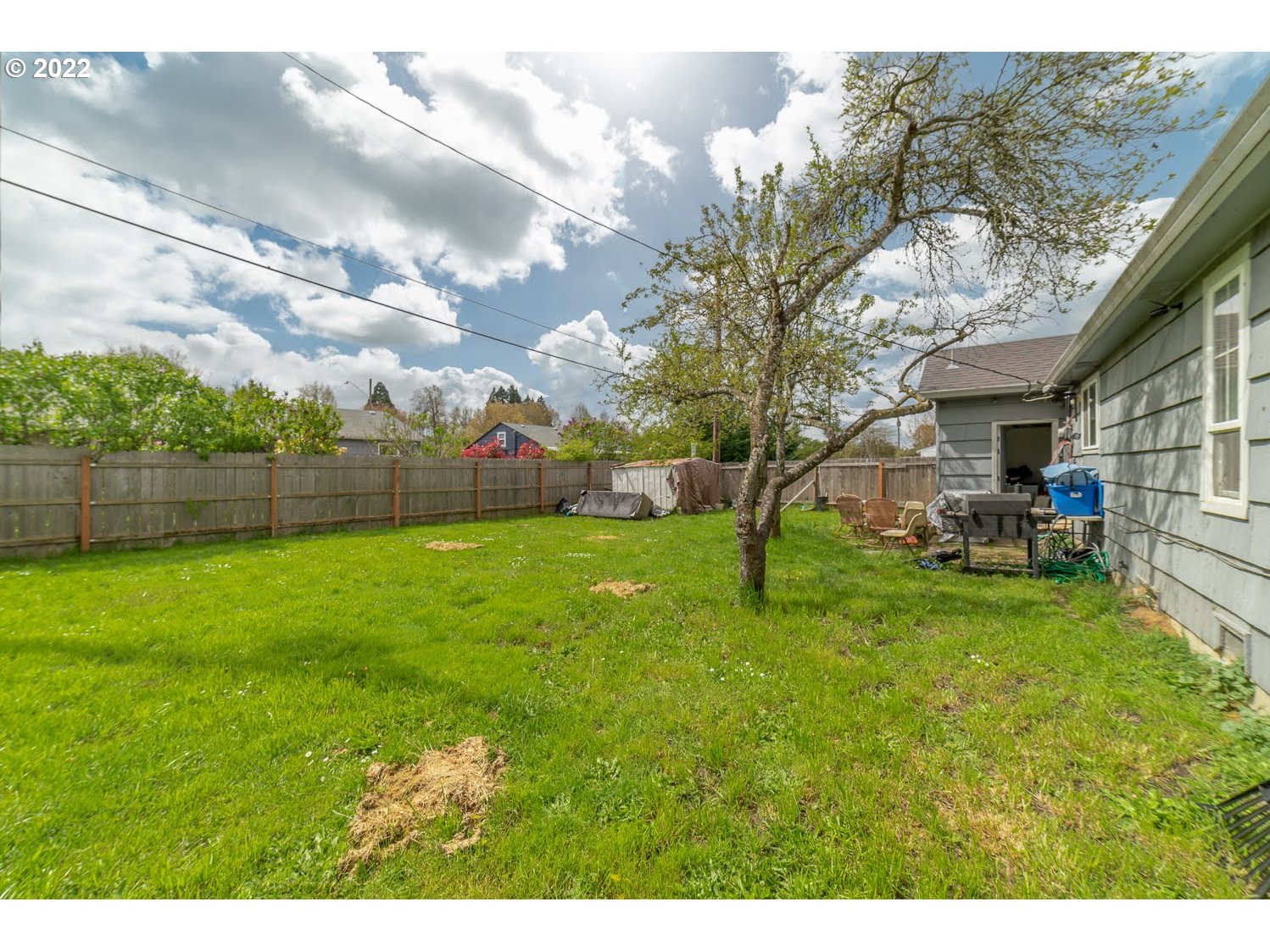 1409 Parker Street Springfield, OR 97477 - Photo 17 of 19 a view of yard with swimming pool and green space