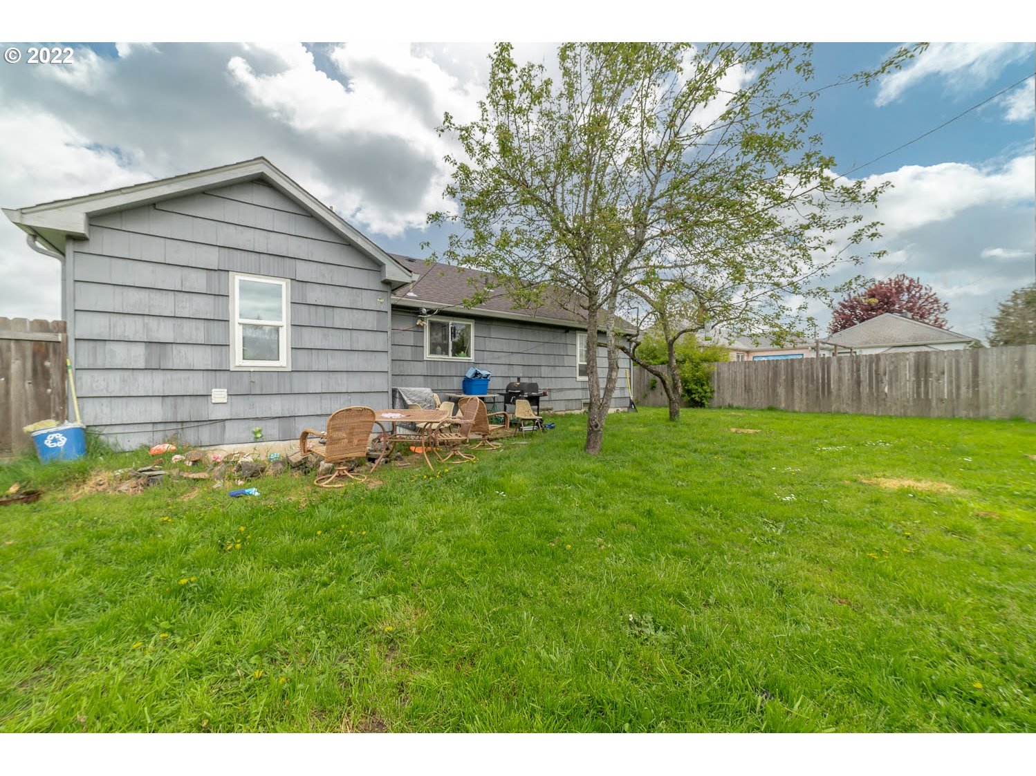 1409 Parker Street Springfield, OR 97477 - Photo 18 of 19 a backyard of a house with table and chairs