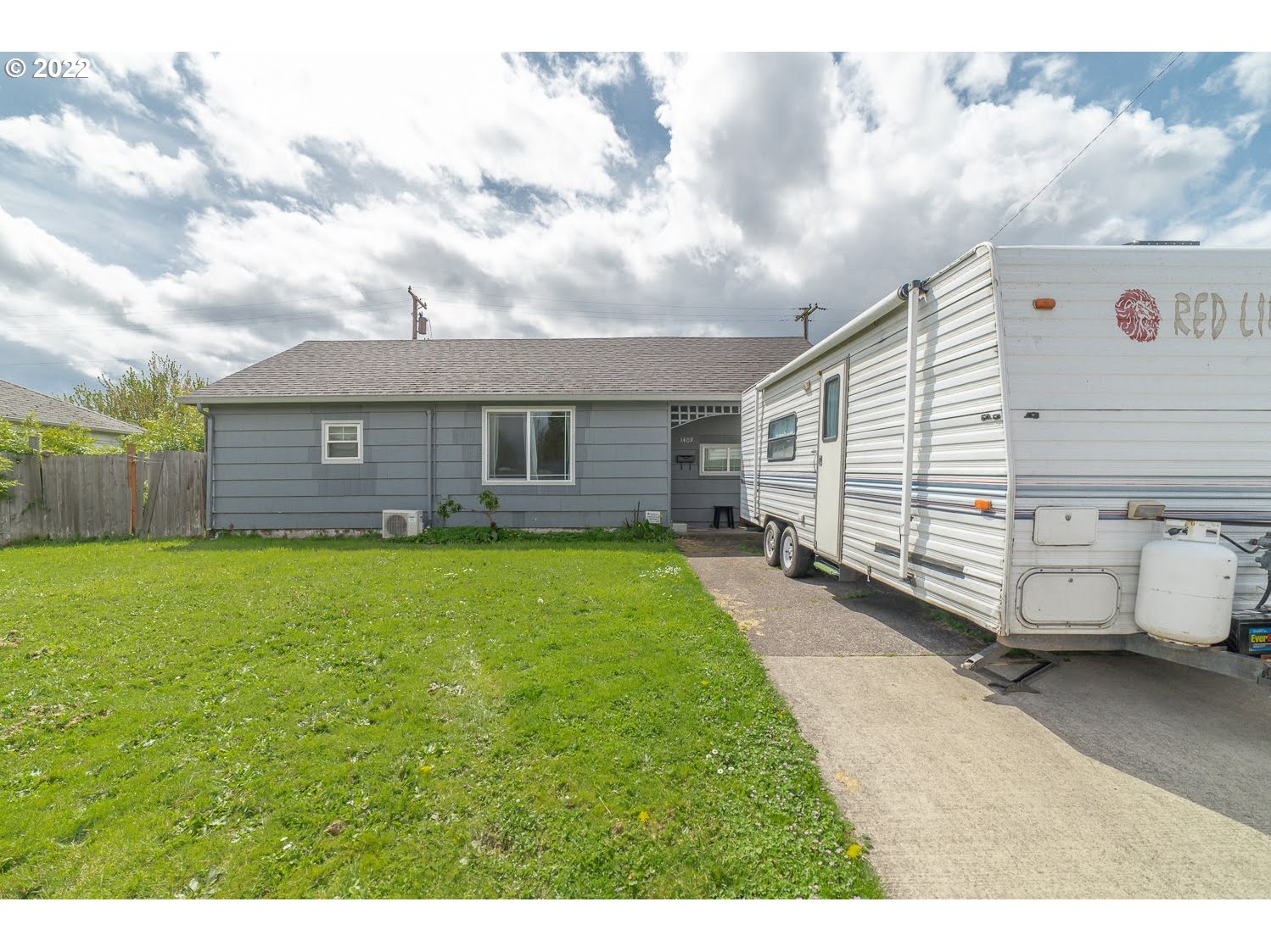 1409 Parker Street Springfield, OR 97477 - Photo 2 of 19 a view of a house with a backyard