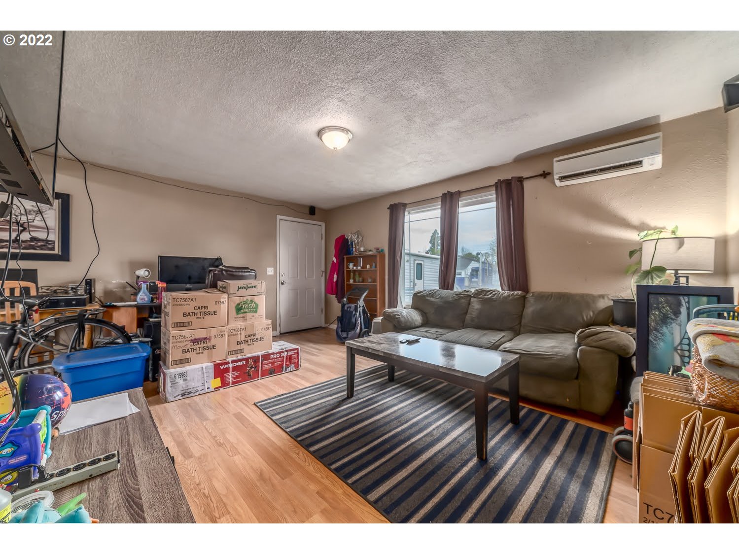 1409 Parker Street Springfield, OR 97477 - Photo 3 of 19 a living room with furniture and a wooden floor