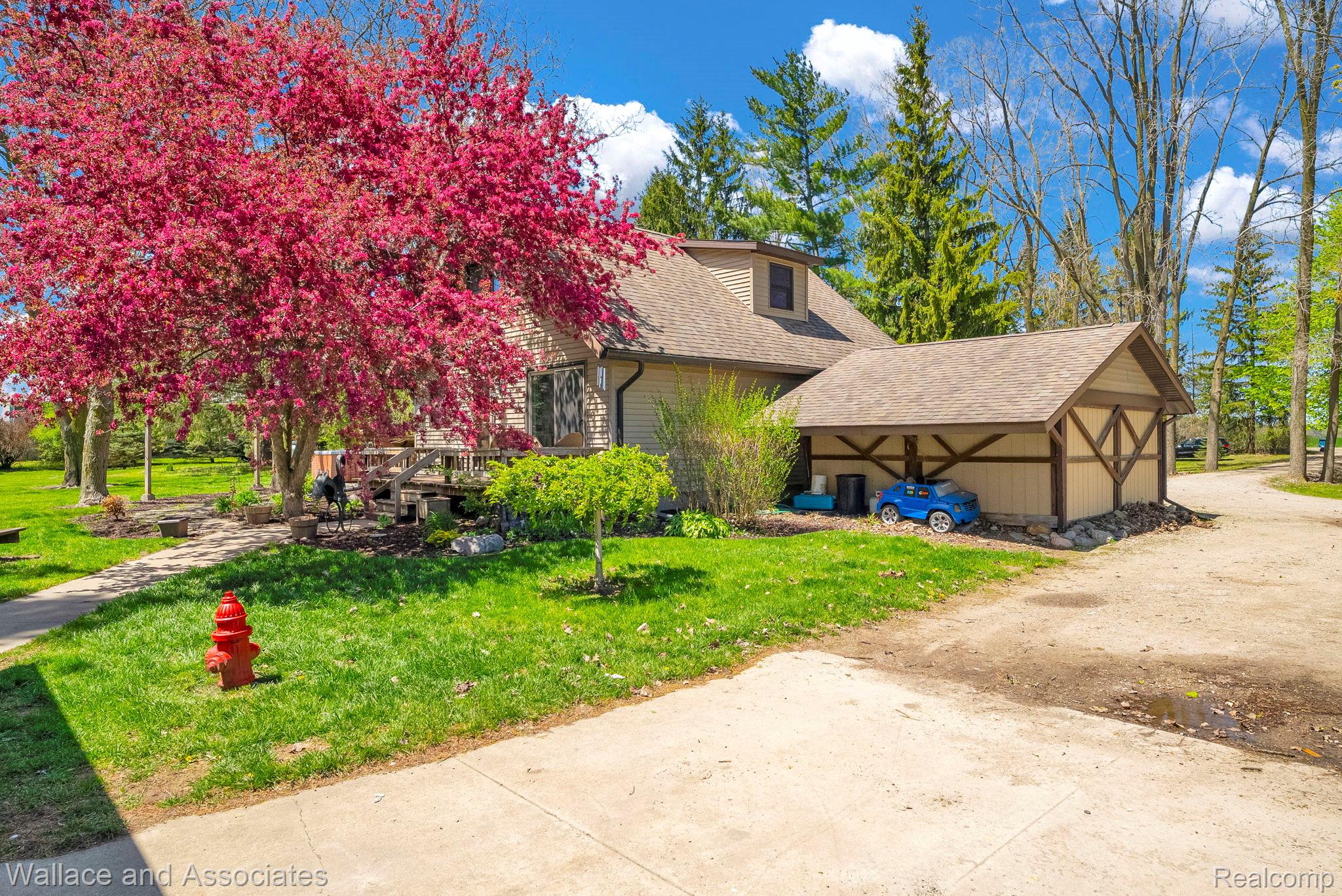 6616 Wellman Line Road Croswell, MI 48422 - Photo 6 of 47 View of front of home featuring roof with shingles and a front lawn