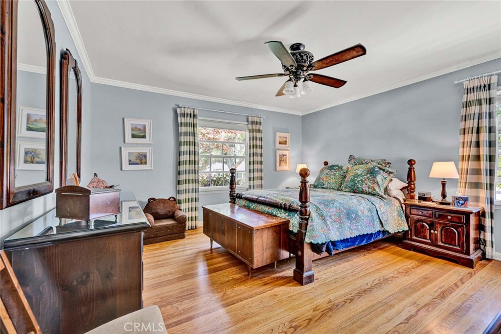 5456 Cadbury Road Whittier, CA 90601 - Photo 16 of 67 a bedroom with a bed and wooden floor