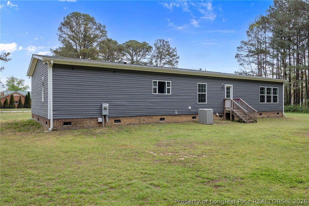 2252 Old Stage Road South Erwin, NC 28339 - Photo 29 of 47 a backyard of a house with table and chairs