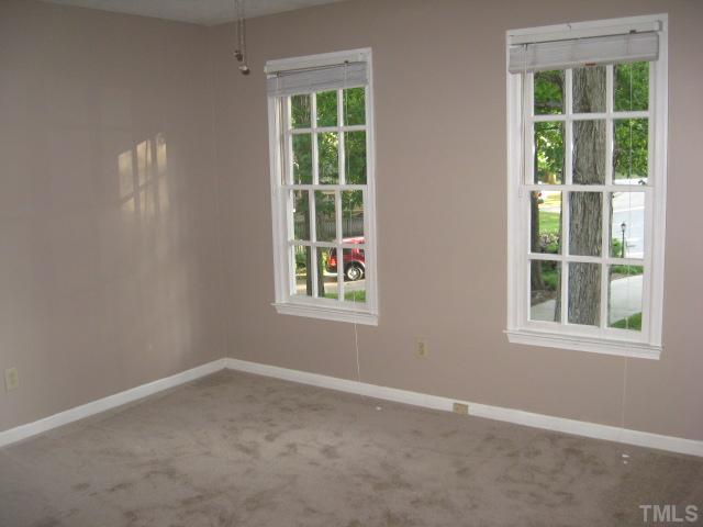 2612 Diamondhitch Trail Raleigh, NC 27615 - Photo 11 of 25 The third bedroom has two windows a ceiling fan, built in shelves in the closet and would make a great child's room.