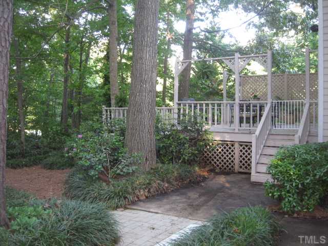 2612 Diamondhitch Trail Raleigh, NC 27615 - Photo 15 of 25 The view of the backyard as you come from the side. Not only is the yard beautiful, peaceful and charming but it is very low maintenance as well. It is a rarity and can be yours!
