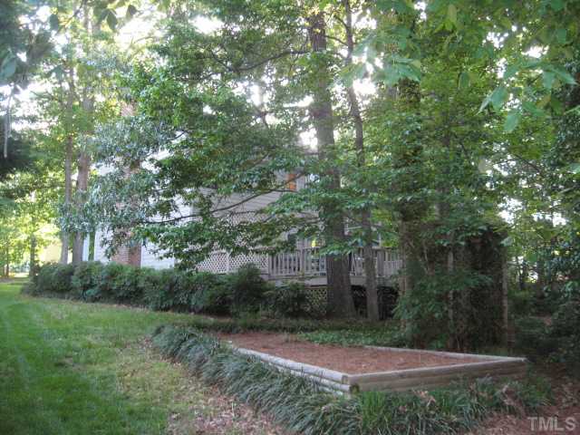 2612 Diamondhitch Trail Raleigh, NC 27615 - Photo 20 of 25 This is a view of the side yard with the raised planting bed.