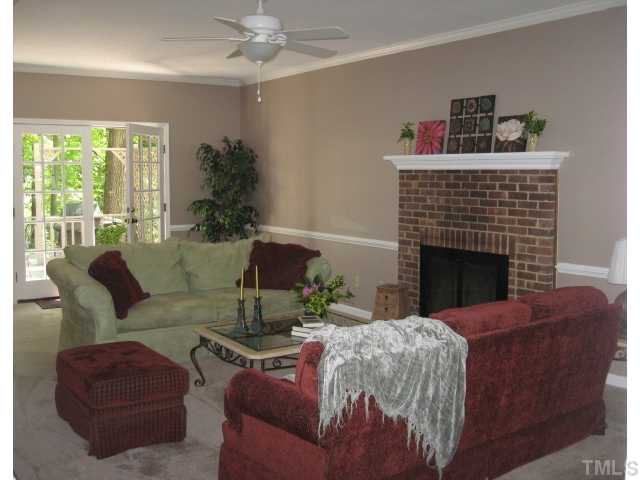2612 Diamondhitch Trail Raleigh, NC 27615 - Photo 4 of 25 The Living Room has crown molding,chair rail, freshly painted,brand new carpet, light fixture and fan, gas log fireplace, french doors to the deck, & 2 windows on the front of the room allowing for ample natural light. A great place to entertain.