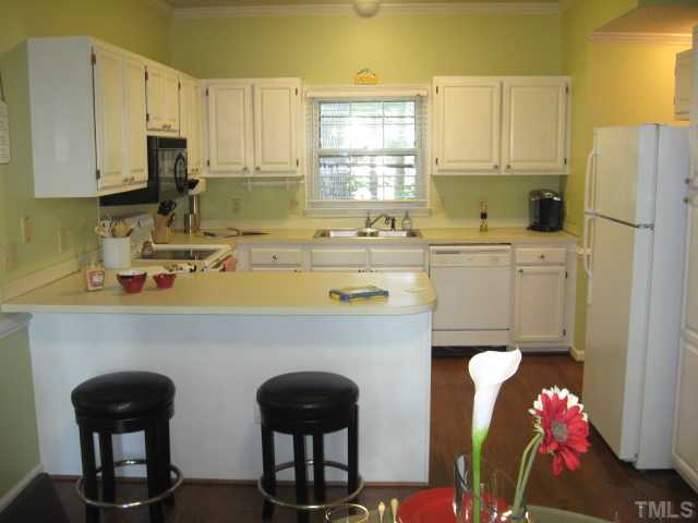 2612 Diamondhitch Trail Raleigh, NC 27615 - Photo 6 of 25 The breakfast bar in the kitchen allows for eating how you feel. The bar separates what could be a mini family room or dining room. the beauty is you get to decide!
