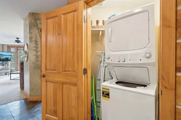 a bedroom with a bed and a night stand