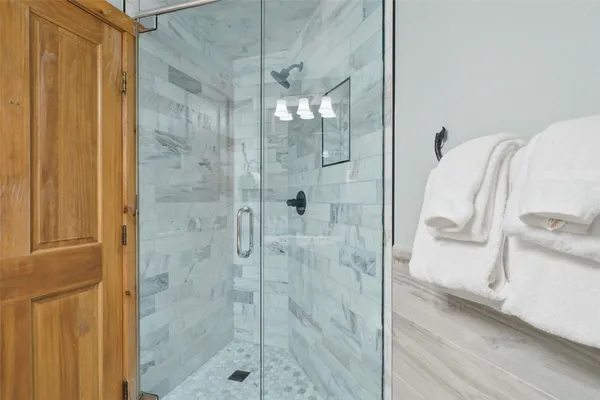 a bathroom with a bathtub and window