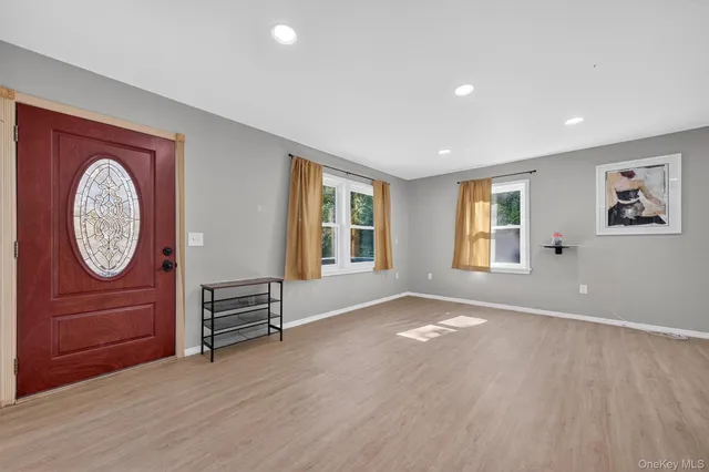wooden floor in a room with a window