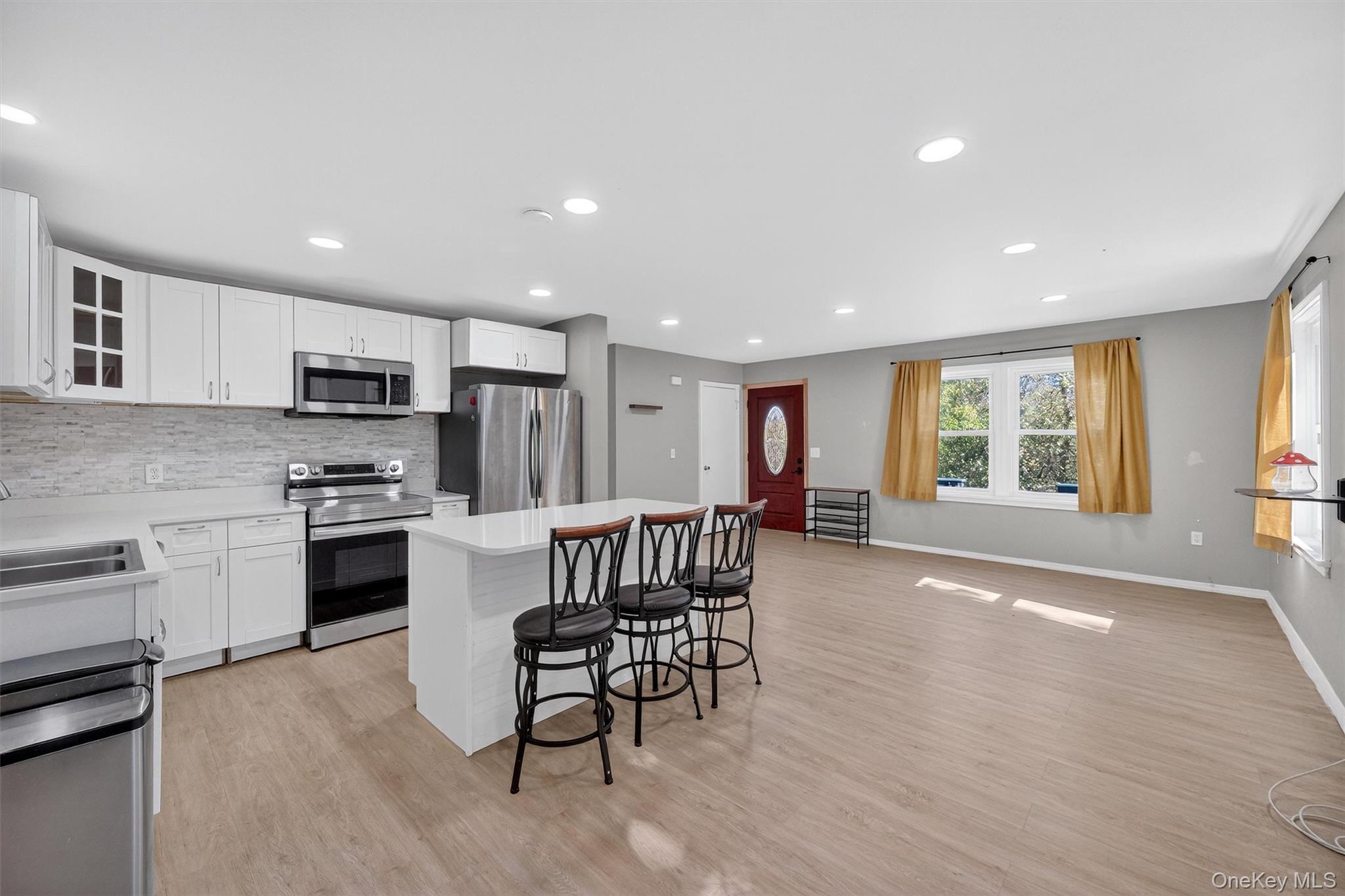 12 3rd Street Milton, NY 12547 - Photo 14 of 34 a kitchen with stainless steel appliances granite countertop a stove a sink a refrigerator and a microwave