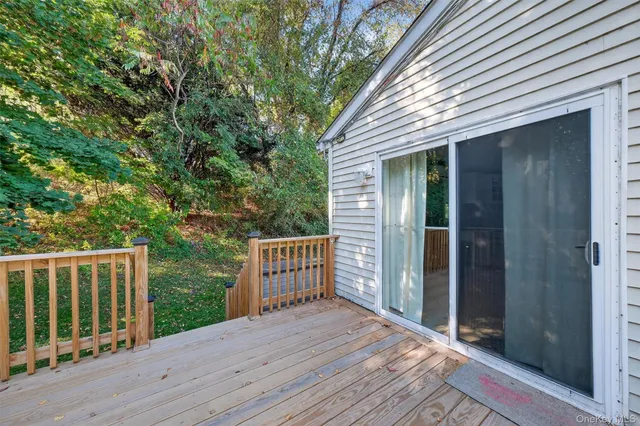 a balcony with wooden floor
