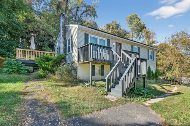 a house with trees in the background