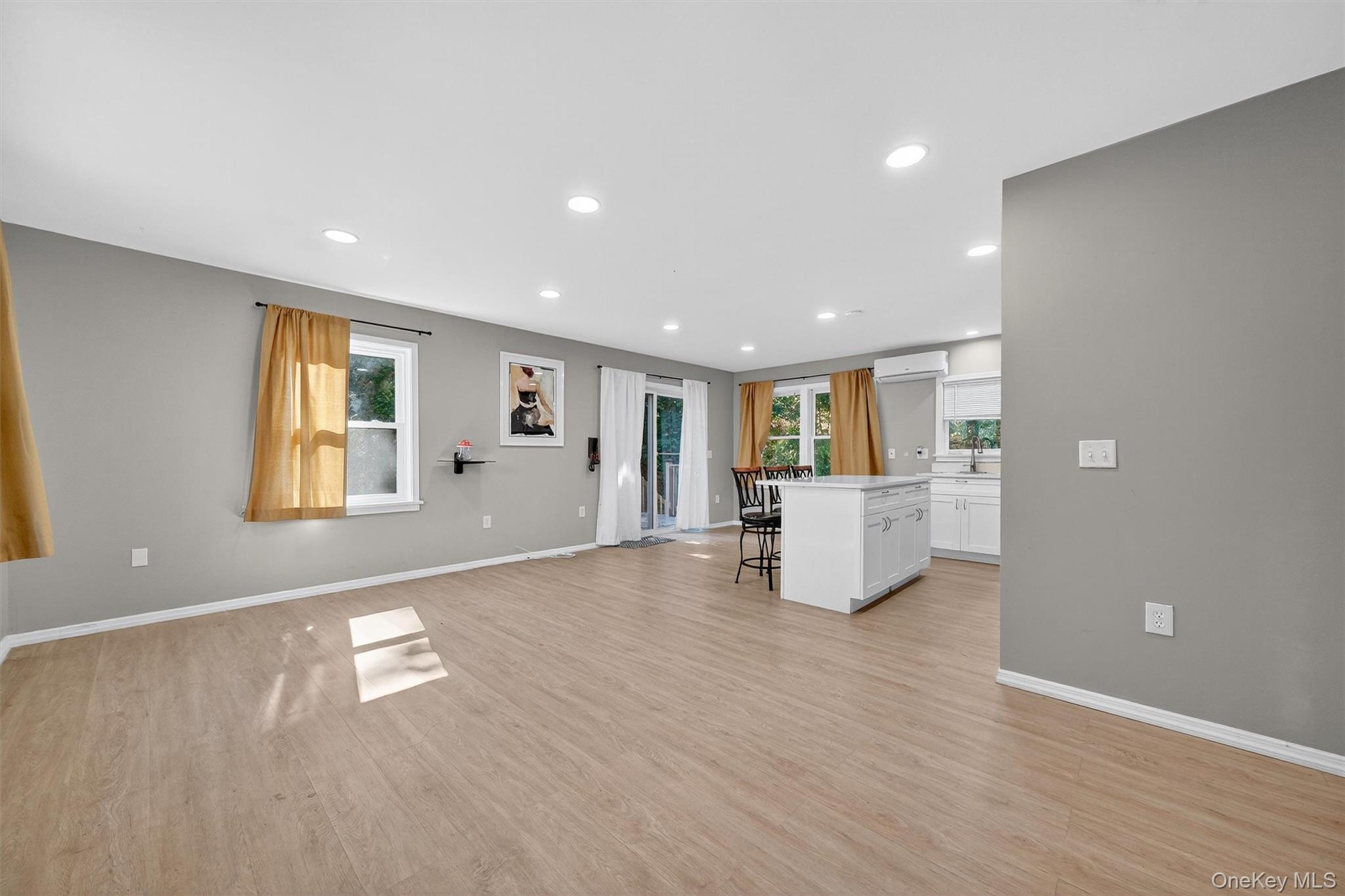 12 3rd Street Milton, NY 12547 - Photo 9 of 34 a view of an empty room with wooden floor and a window