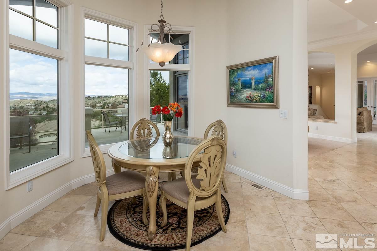125 Hawken Road Reno, NV 89519 - Photo 12 of 25 a dining room with furniture a chandelier and wooden floor