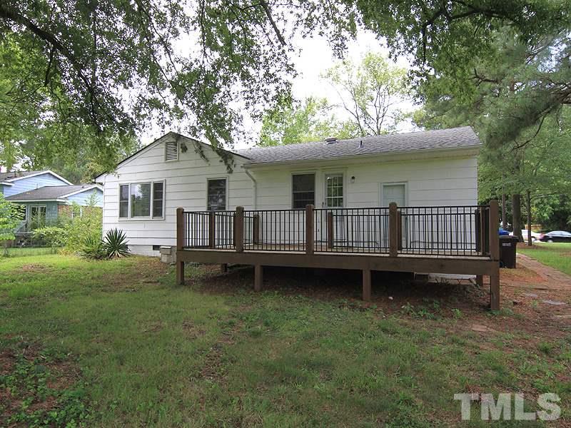 4609 Revere Road Durham, NC 27713 - Photo 12 of 12 a view of a house with a yard and sitting area