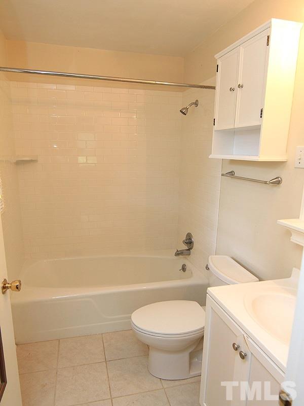4609 Revere Road Durham, NC 27713 - Photo 10 of 12 a bathroom with a toilet sink and shower