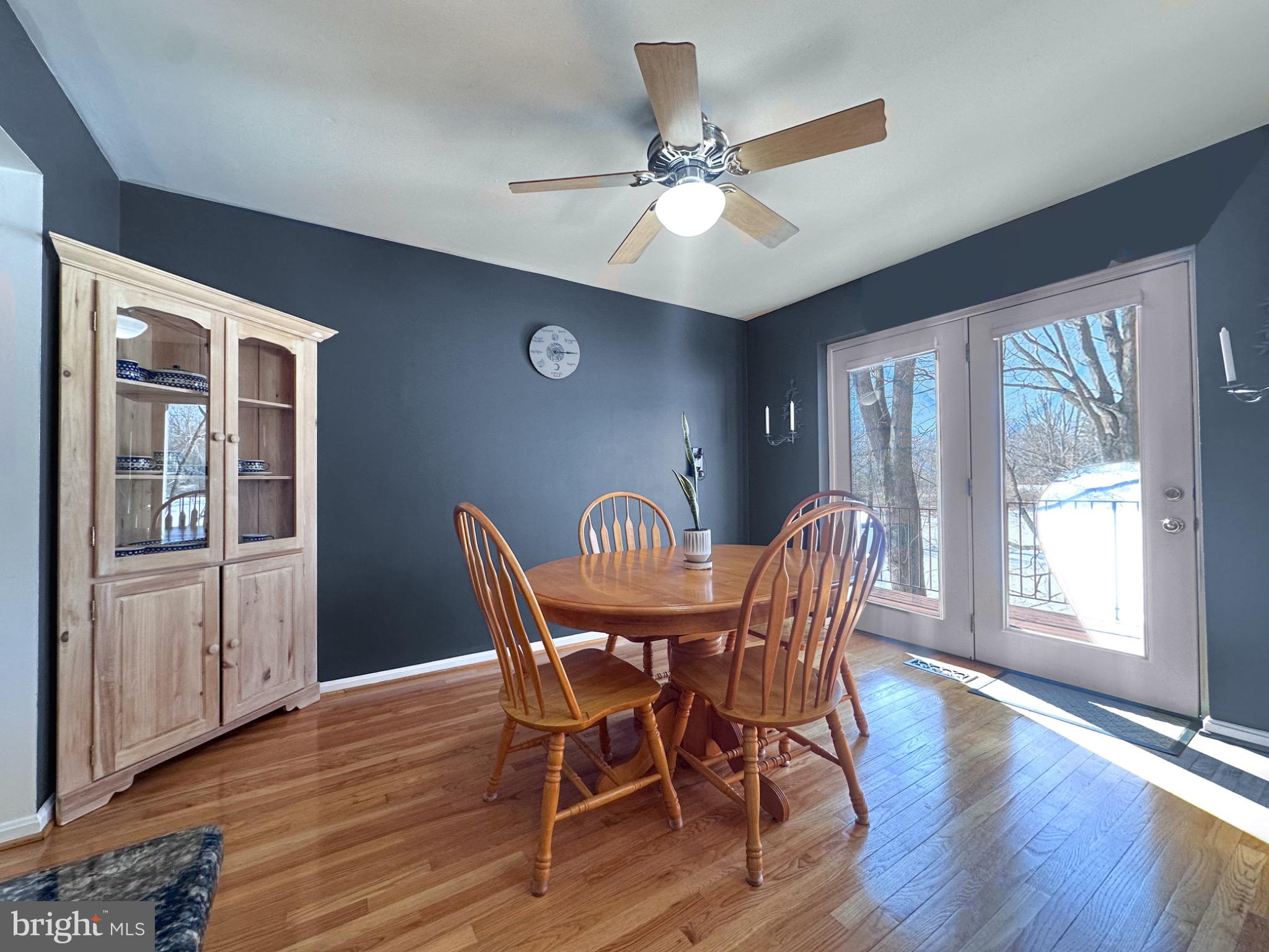 2158 Golf Course Drive Reston, VA 20191 - Photo 11 of 35 a view of a dining room with furniture window and wooden floor
