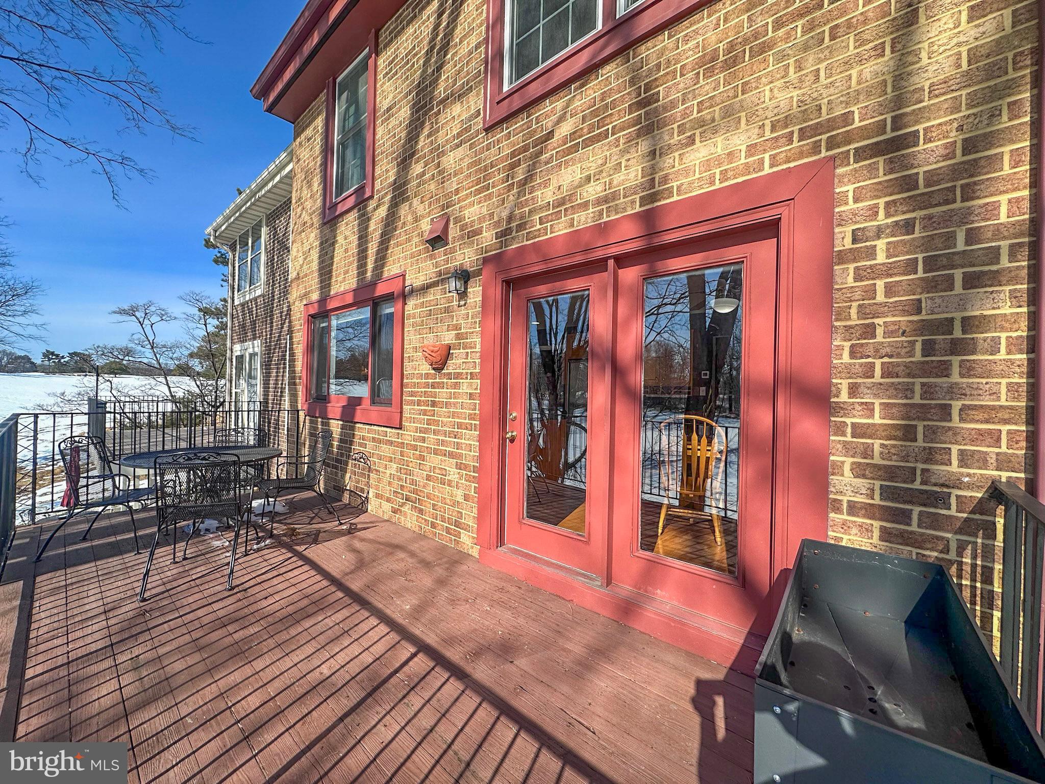 2158 Golf Course Drive Reston, VA 20191 - Photo 12 of 35 a view of a brick building with a bench in patio