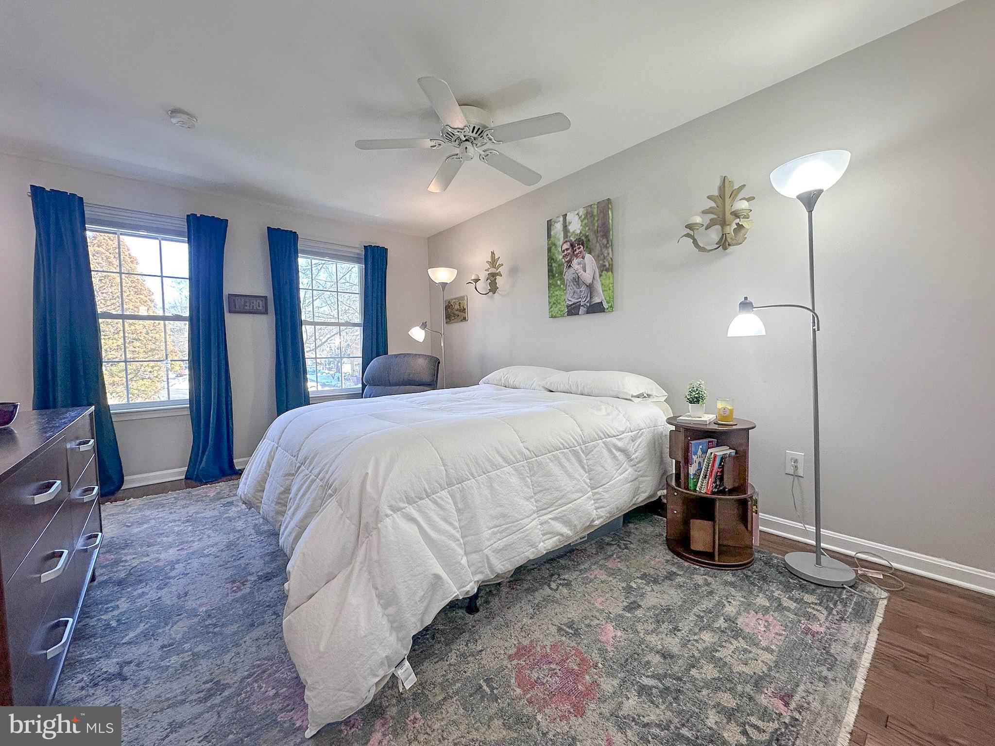2158 Golf Course Drive Reston, VA 20191 - Photo 14 of 35 a bedroom with a bed and a chandelier