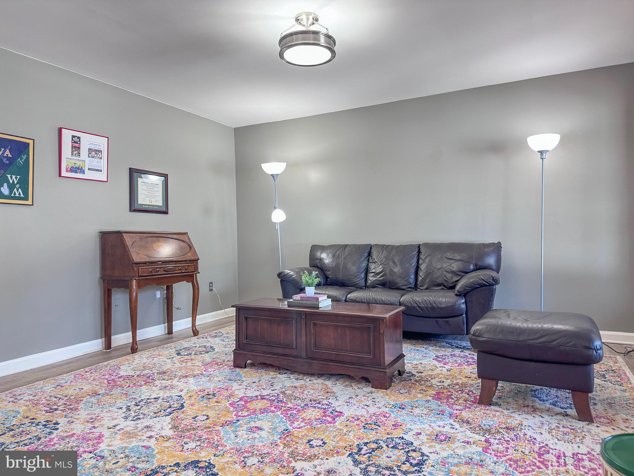 2158 Golf Course Drive Reston, VA 20191 - Photo 21 of 35 a living room with furniture and a lamp