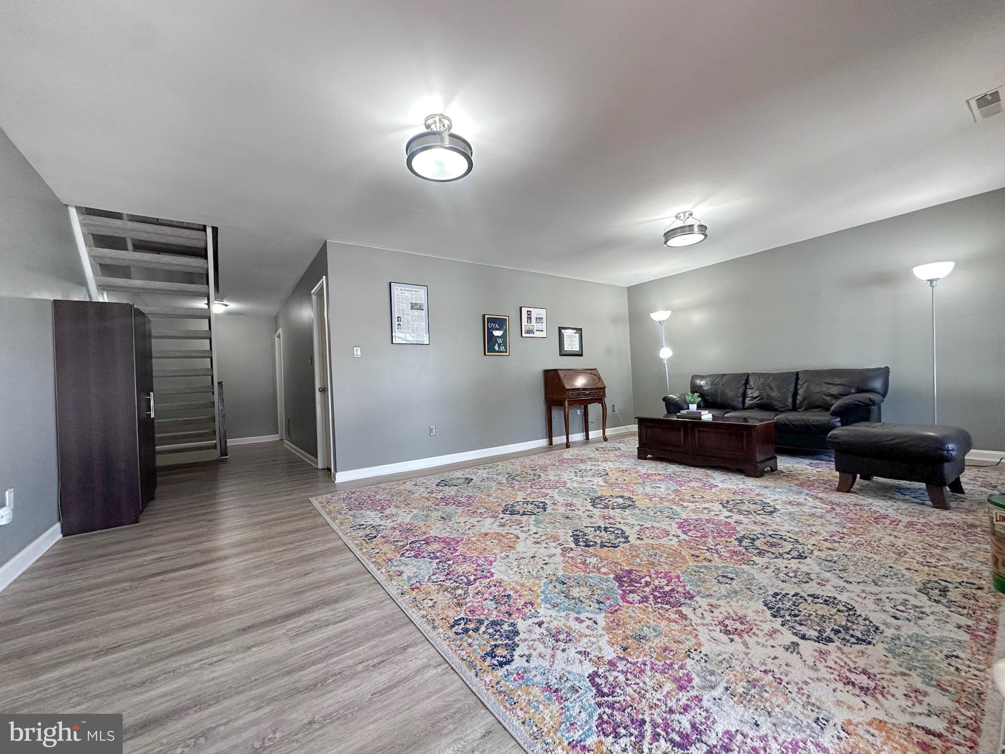 2158 Golf Course Drive Reston, VA 20191 - Photo 23 of 35 a living room with furniture and a wooden floor