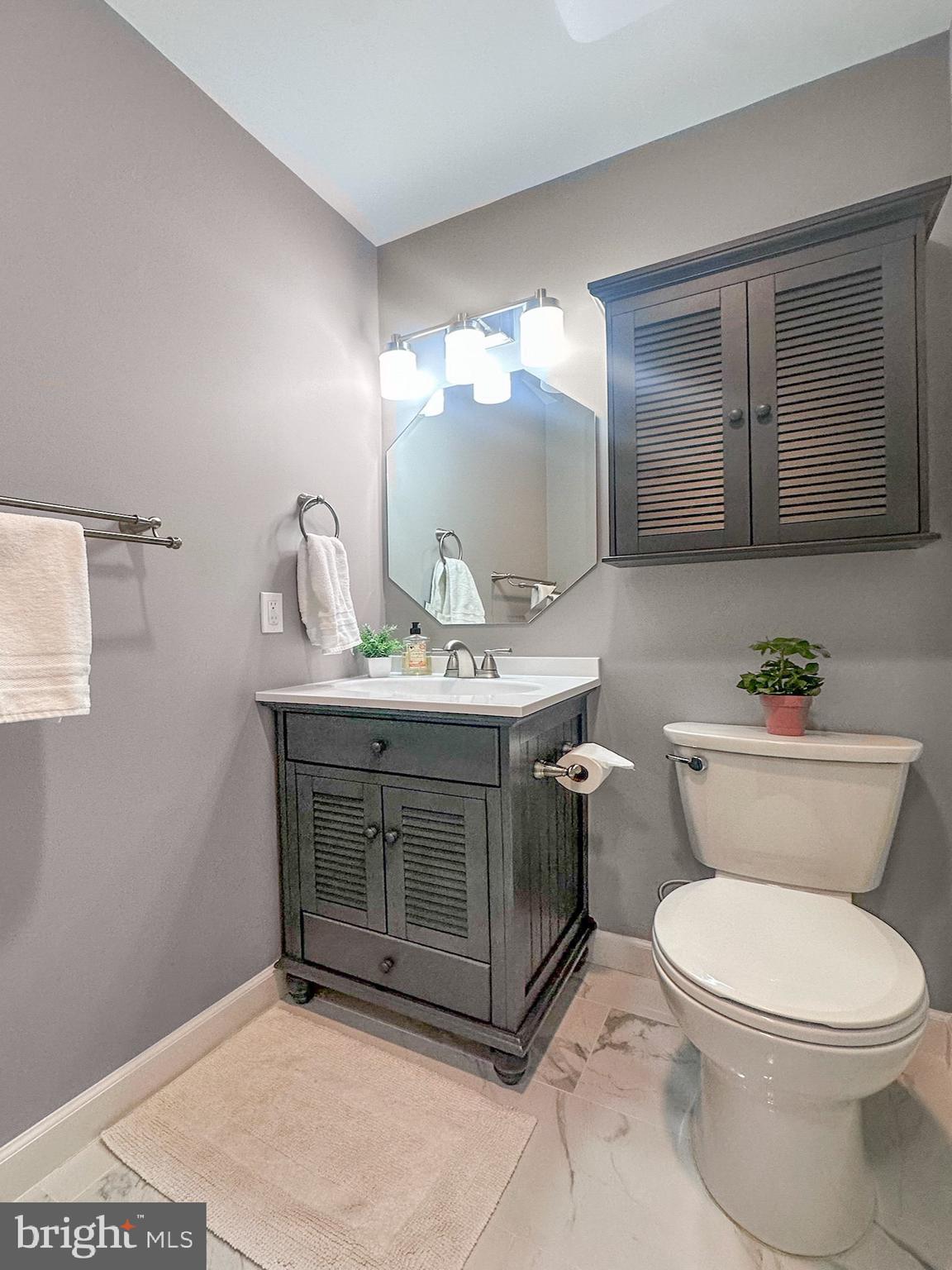 2158 Golf Course Drive Reston, VA 20191 - Photo 25 of 35 a bathroom with a sink toilet and mirror