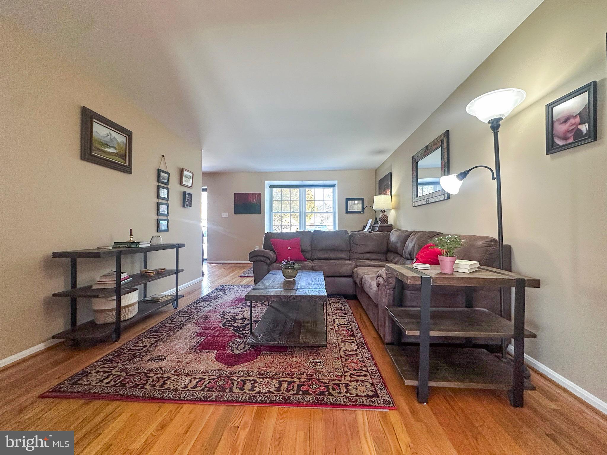 2158 Golf Course Drive Reston, VA 20191 - Photo 4 of 35 a living room with furniture and a wooden floor