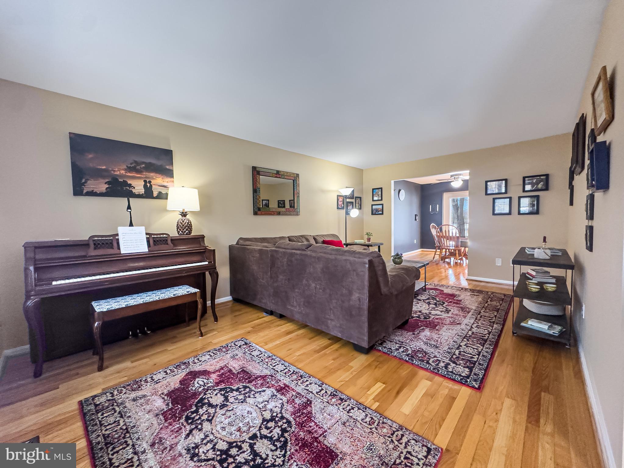 2158 Golf Course Drive Reston, VA 20191 - Photo 5 of 35 a living room with furniture and a wooden floor