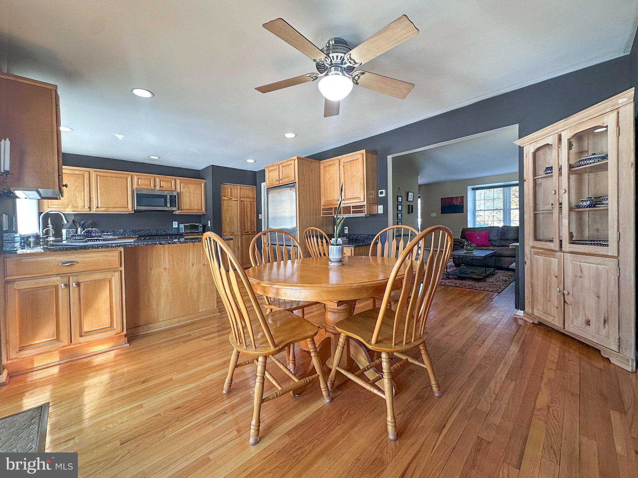 2158 Golf Course Drive Reston, VA 20191 - Photo 7 of 35 a dining room with furniture a window and wooden floor