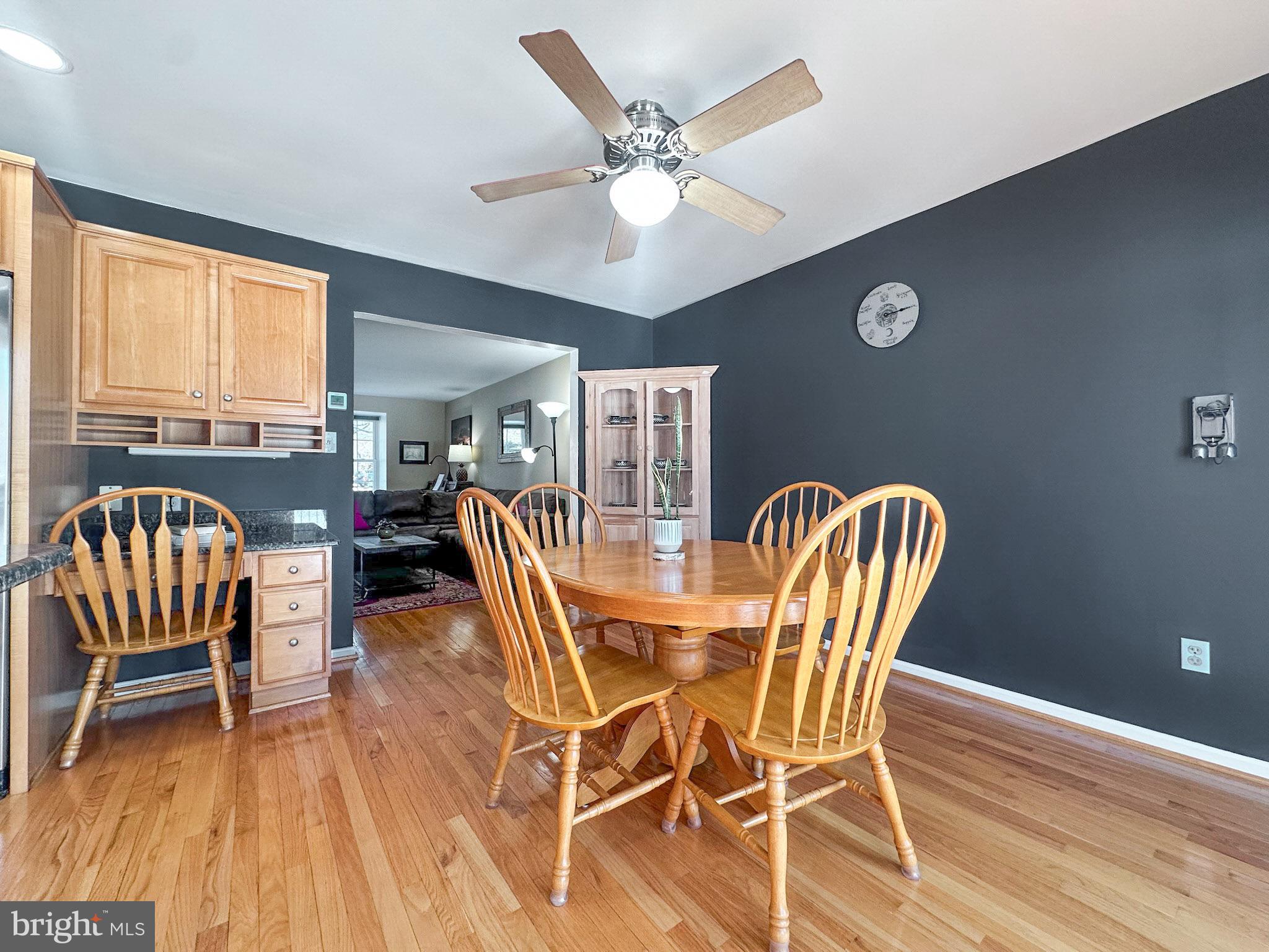 2158 Golf Course Drive Reston, VA 20191 - Photo 8 of 35 a dining room with furniture and wooden floor