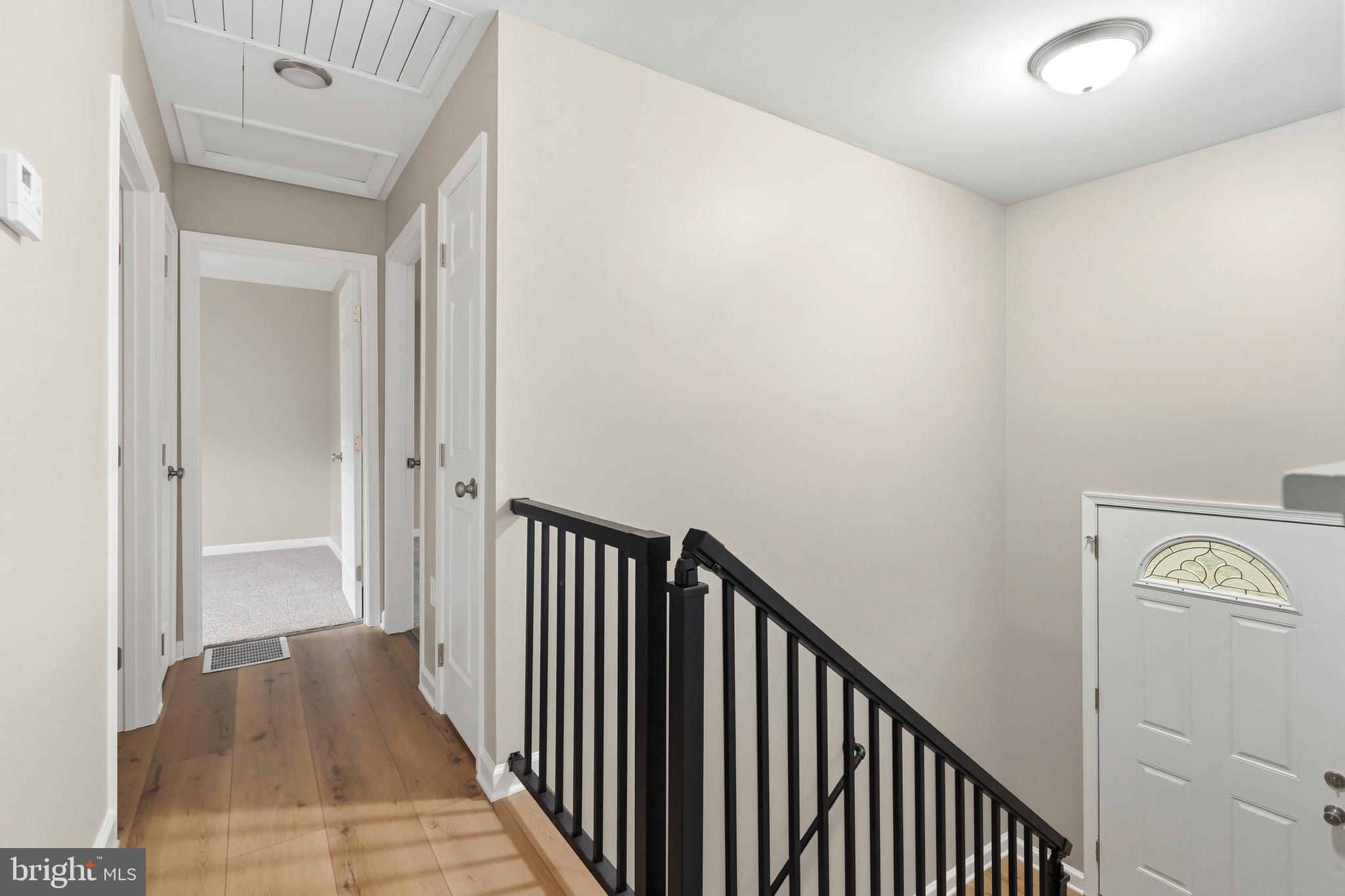 404 Weeping Willow Road Falling Waters, WV 25419 - Photo 16 of 24 a view of a hallway with wooden floor