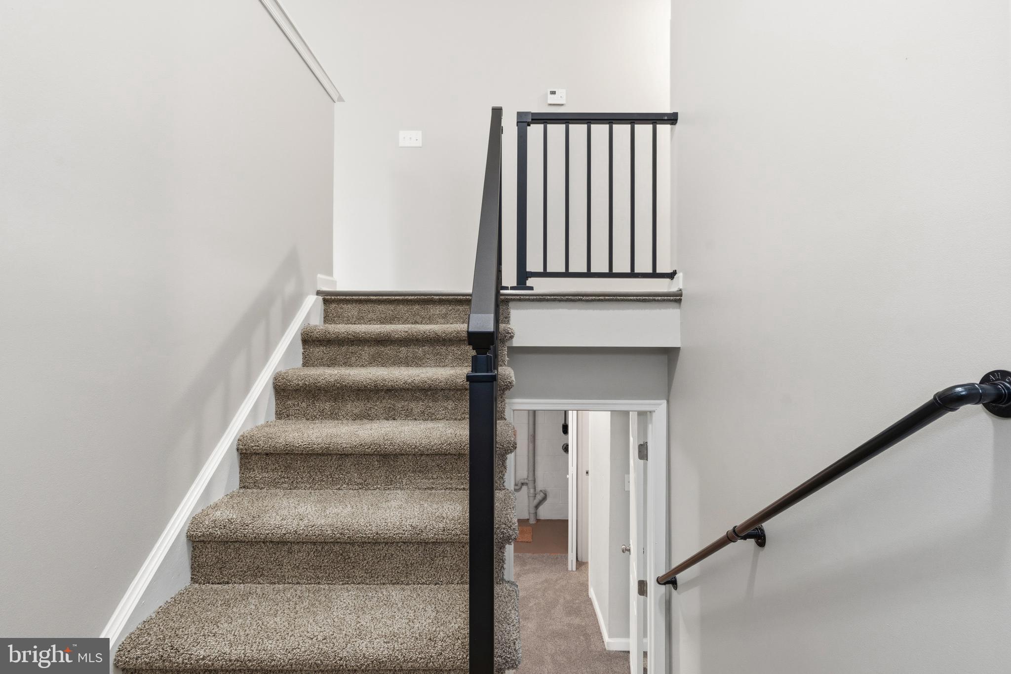 404 Weeping Willow Road Falling Waters, WV 25419 - Photo 5 of 24 a view of staircase with white walls and a window