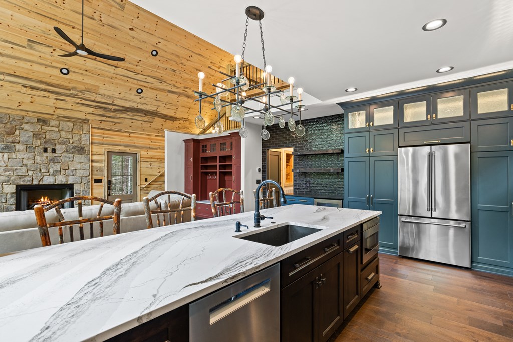46 Rivers End Way Suches, GA 30572 - Photo 14 of 76 a kitchen with stainless steel appliances granite countertop a sink refrigerator and cabinets