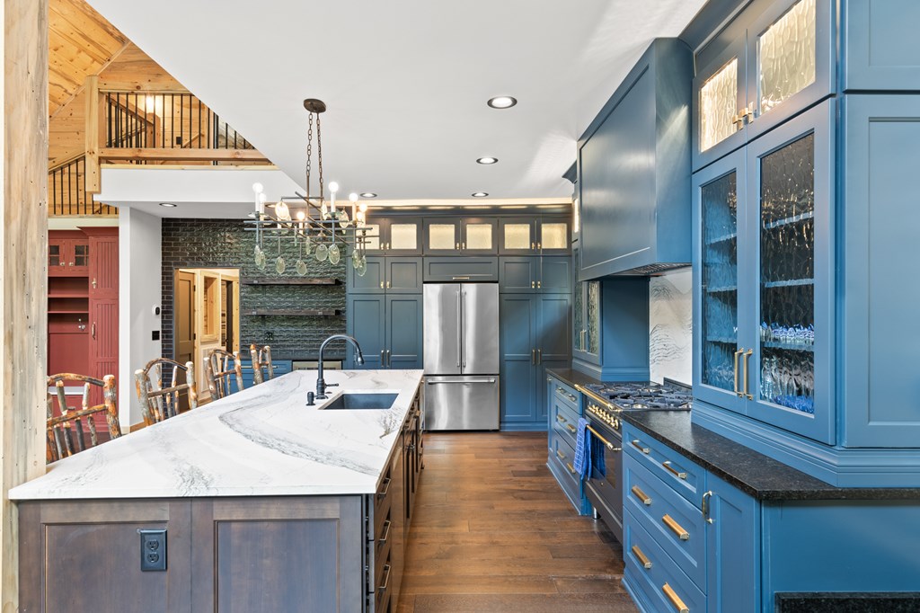 46 Rivers End Way Suches, GA 30572 - Photo 15 of 76 a kitchen with stainless steel appliances granite countertop a kitchen island a stove and a dining table top oven