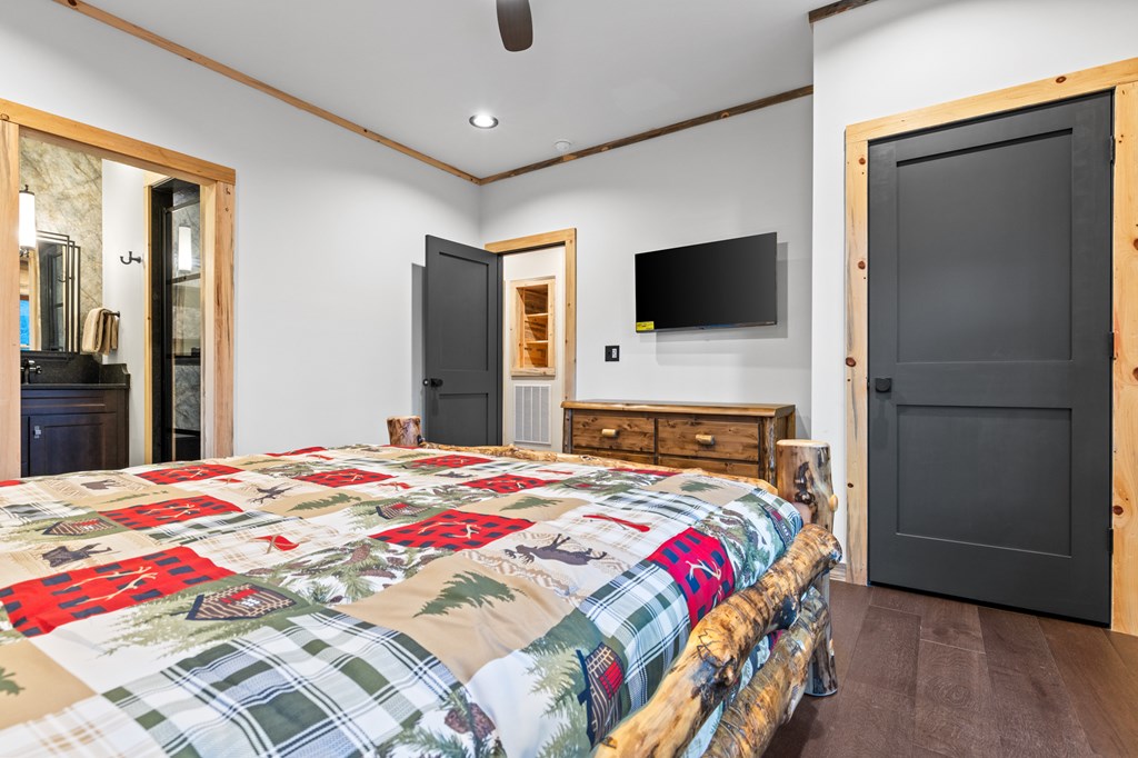 46 Rivers End Way Suches, GA 30572 - Photo 21 of 76 a bedroom with a bed and a flat screen tv