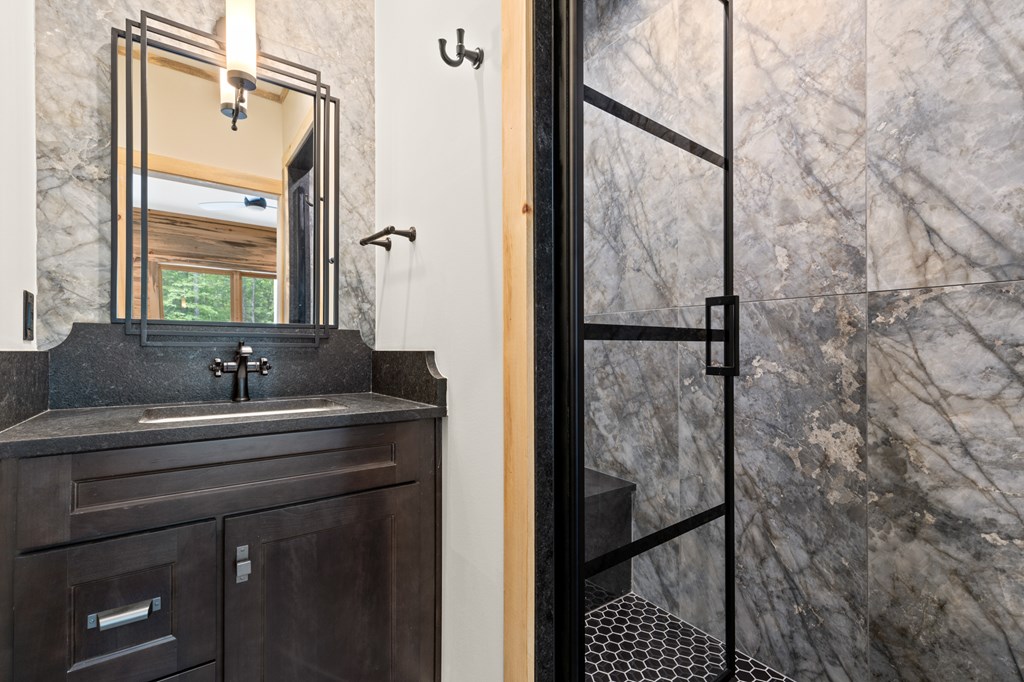 46 Rivers End Way Suches, GA 30572 - Photo 25 of 76 a bathroom with a sink and a mirror
