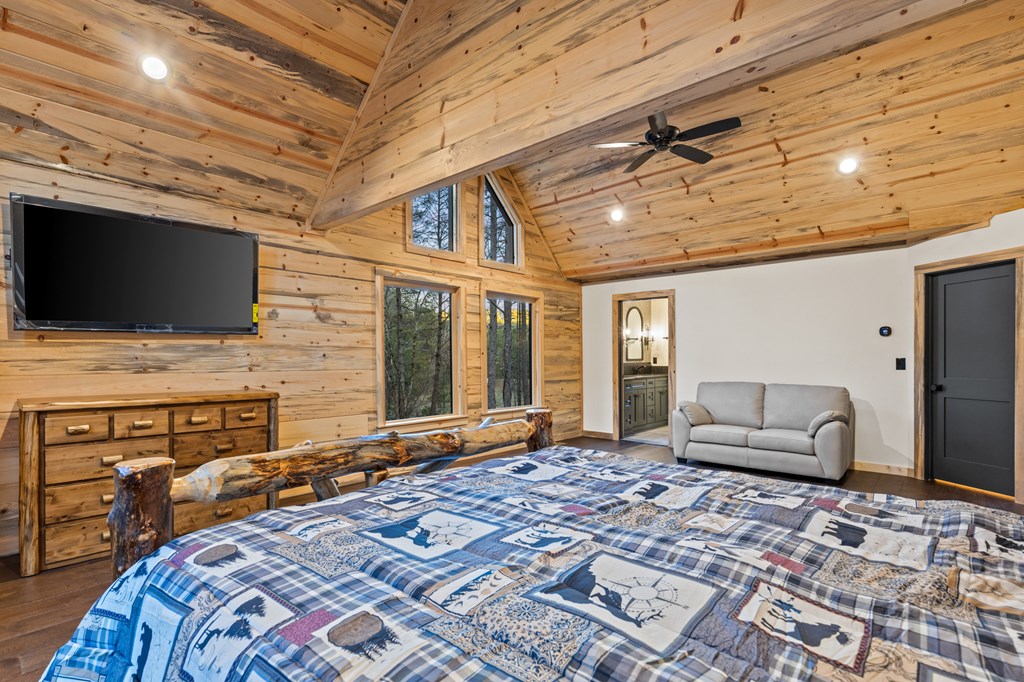 46 Rivers End Way Suches, GA 30572 - Photo 32 of 76 a bedroom with a bed and flat screen tv