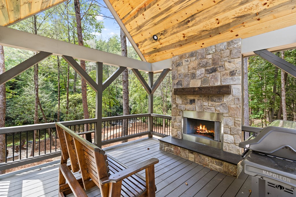 46 Rivers End Way Suches, GA 30572 - Photo 49 of 76 a deck with wooden floor and outdoor seating