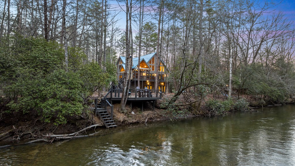 46 Rivers End Way Suches, GA 30572 - Photo 7 of 76 a view of a lake with a house in the background