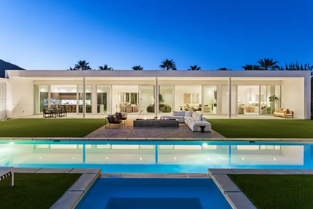a view of an chairs and table in the patio