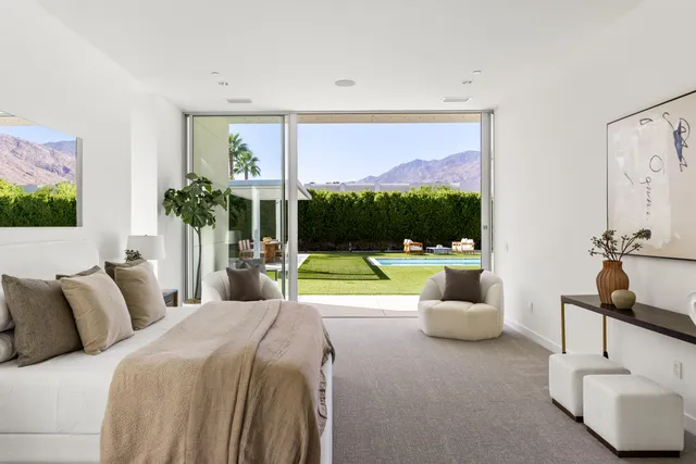 a bedroom with a bed and a couch